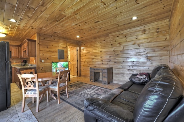 dining space with electric panel, wooden walls, wood ceiling, and recessed lighting