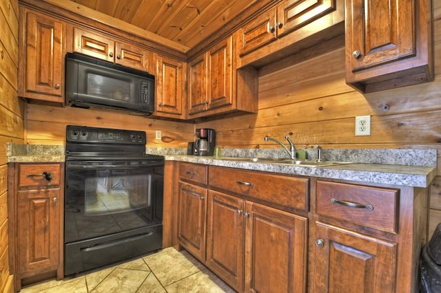 kitchen with black appliances, a sink, wood walls, light countertops, and wood ceiling