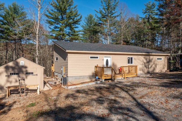 rear view of house with an outbuilding