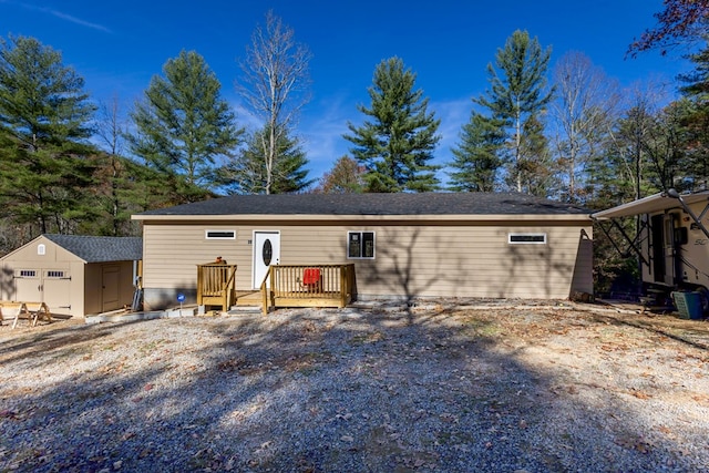 view of front of property with a shed and a deck