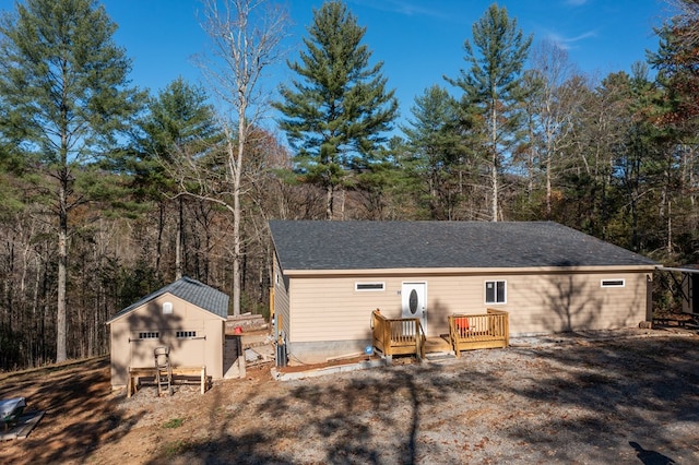 exterior space with an outdoor structure and a wooden deck