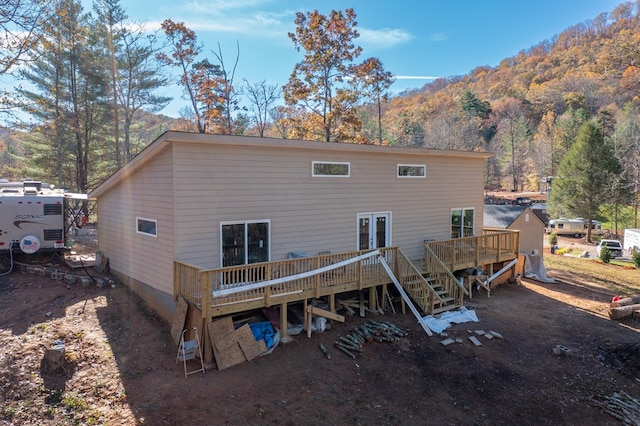 back of house featuring a deck with mountain view