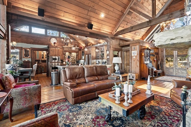 living room with wooden ceiling, plenty of natural light, beamed ceiling, and wood finished floors