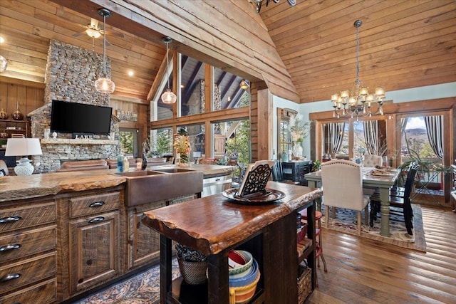 dining area with wooden ceiling, dark wood-style floors, high vaulted ceiling, and ceiling fan with notable chandelier