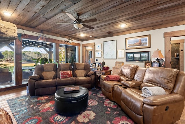 living area featuring ceiling fan, wood finished floors, and wood ceiling