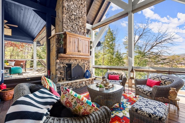 exterior space with lofted ceiling, an outdoor stone fireplace, and wooden ceiling