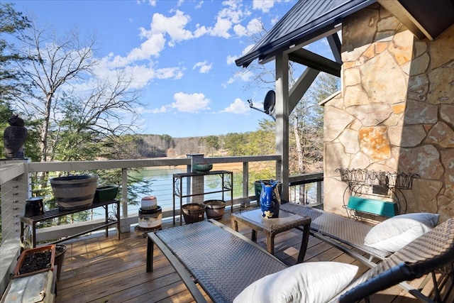 deck featuring a water view