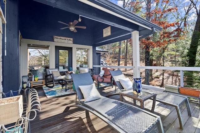 wooden deck featuring ceiling fan