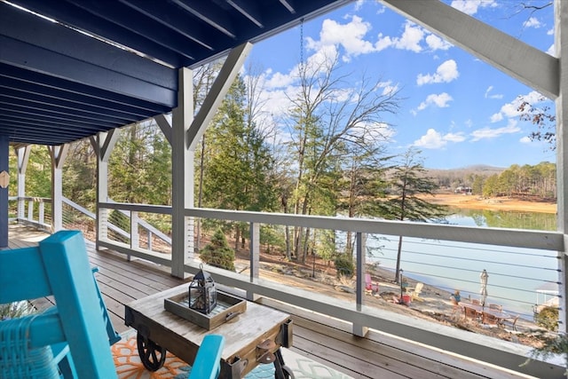 wooden deck with a water view