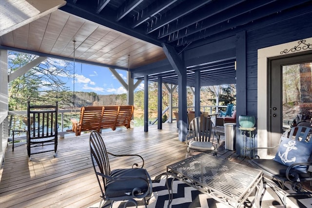 wooden terrace featuring an outdoor hangout area