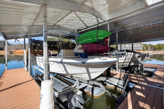 view of dock featuring a water view and boat lift