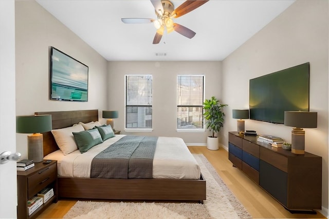 bedroom featuring ceiling fan and light hardwood / wood-style floors