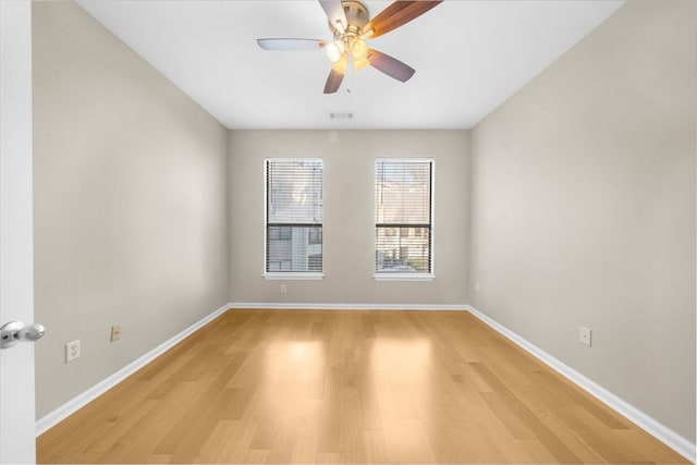 spare room with ceiling fan and light hardwood / wood-style flooring