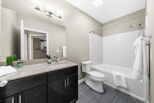 full bathroom featuring shower / bathing tub combination, vanity, and toilet