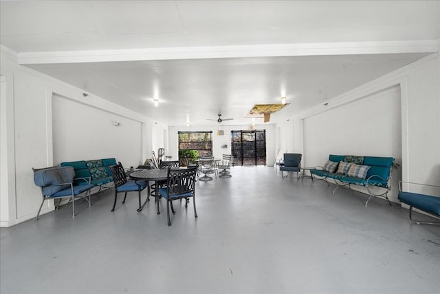 dining area featuring concrete flooring