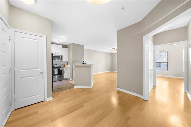 corridor featuring light hardwood / wood-style floors