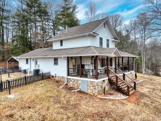 view of front of house with ceiling fan, a sunroom, and central air condition unit