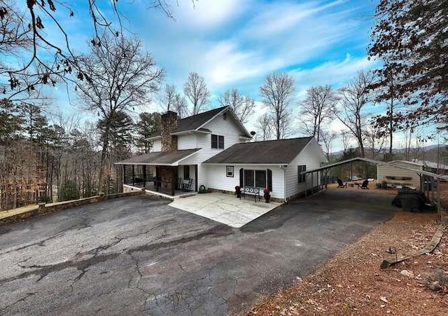 view of front of house featuring a carport