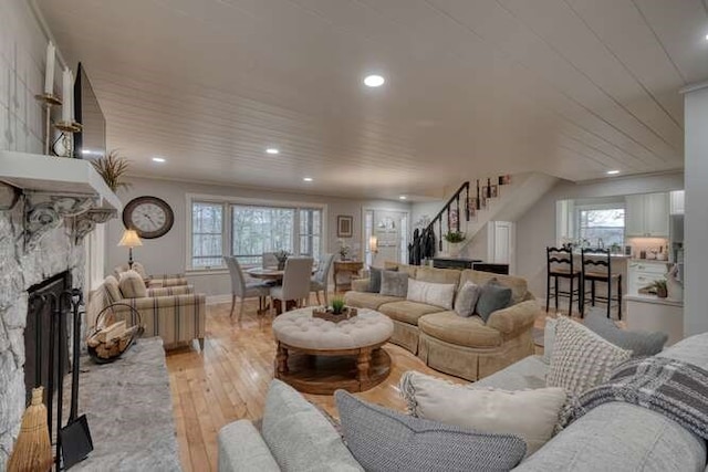 living room with a fireplace and light hardwood / wood-style floors