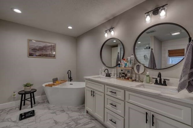 bathroom featuring vanity and a bathtub