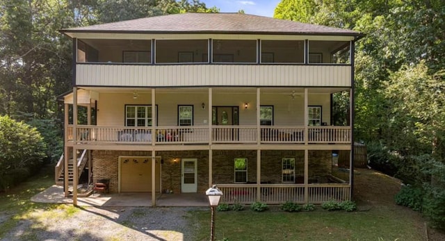 view of front of home with a garage and a patio