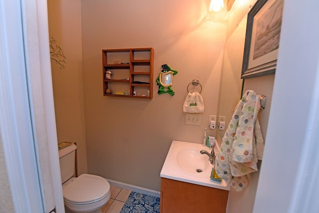 bathroom with vanity, toilet, and tile patterned flooring