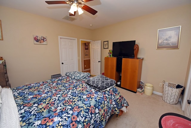 carpeted bedroom with ceiling fan