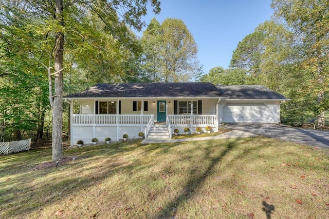 single story home with a garage, a porch, and a front lawn