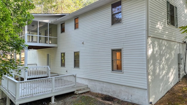 rear view of house with a wooden deck