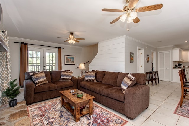 living area featuring light tile patterned floors, french doors, ceiling fan, and crown molding