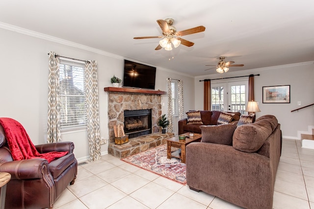 living room featuring a ceiling fan, a wealth of natural light, and ornamental molding