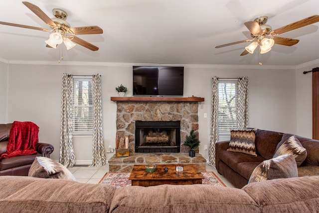 living area featuring tile patterned floors, crown molding, and a ceiling fan