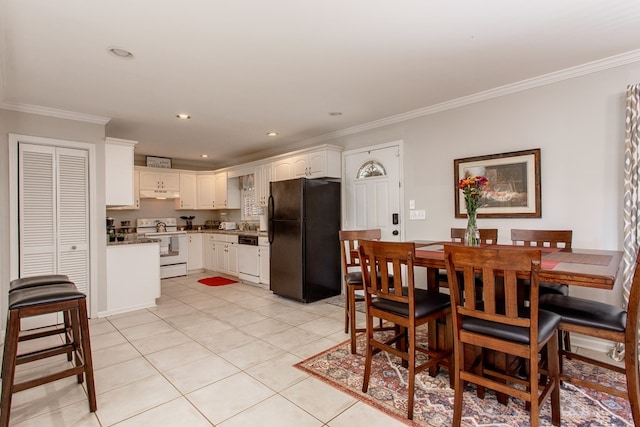 dining space with light tile patterned floors, recessed lighting, and crown molding