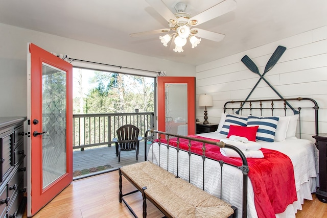 bedroom with light wood finished floors, ceiling fan, and access to outside