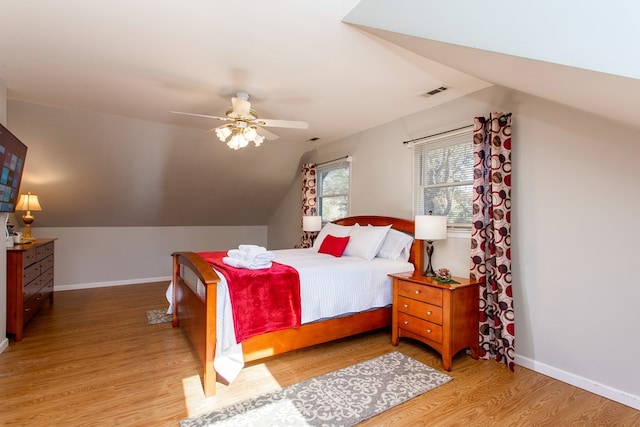 bedroom featuring wood finished floors, visible vents, and baseboards