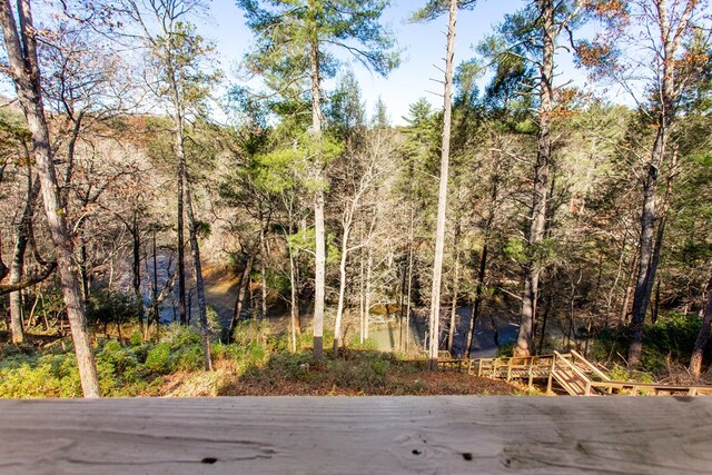 view of street featuring a wooded view