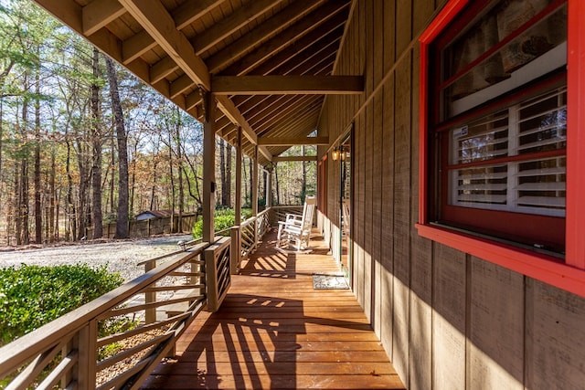 wooden terrace featuring covered porch