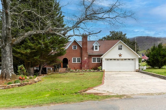 view of front facade featuring a front lawn, a chimney, and driveway