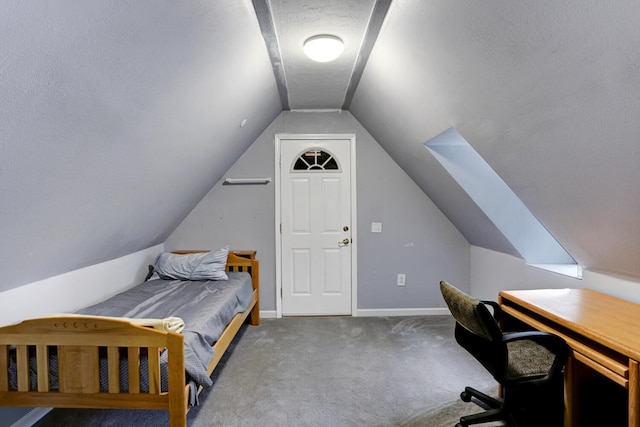 carpeted bedroom with baseboards and vaulted ceiling