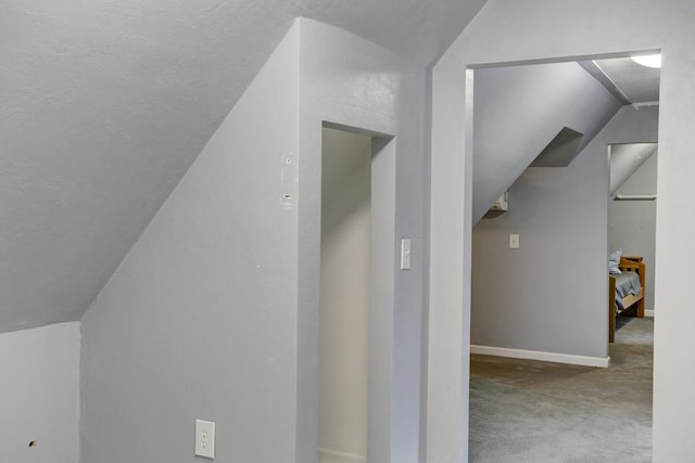 bonus room with lofted ceiling, carpet, and baseboards