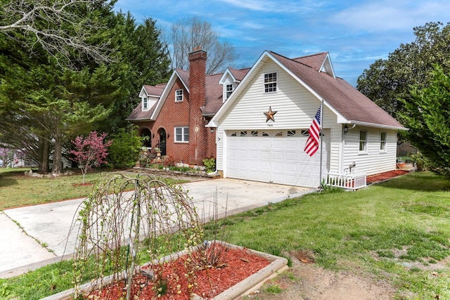 view of front of property with roof with shingles, concrete driveway, a front yard, a garage, and a chimney