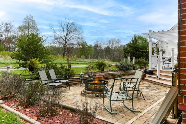 view of patio / terrace featuring a pergola and an outdoor fire pit