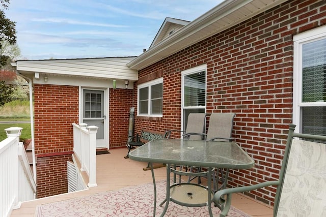 view of patio / terrace featuring outdoor dining space and a wooden deck