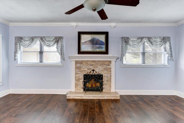 unfurnished living room with crown molding, wood finished floors, a wealth of natural light, and ceiling fan