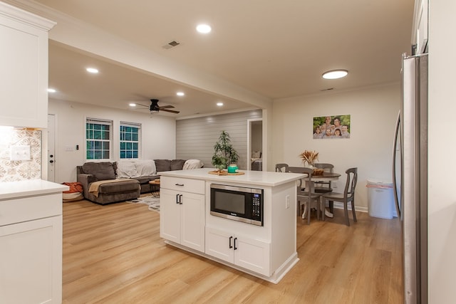 68 Phillips Crk, Andrews, NC 28901 - kitchen featuring stainless steel appliances, light wood-style flooring, white cabinets, recessed lighting, and open floor plan