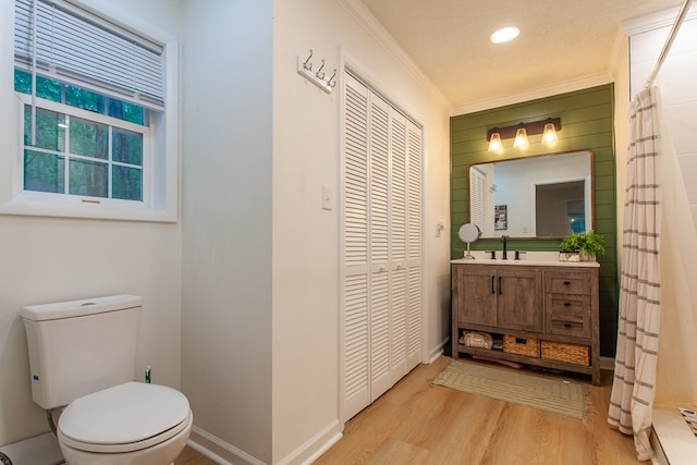 68 Phillips Crk, Andrews, NC 28901 - bathroom with wood finished floors, toilet, vanity, a closet, and ornamental molding