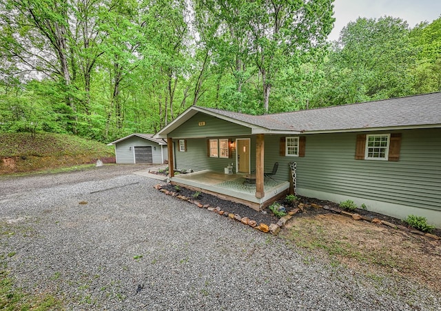 68 Phillips Crk, Andrews, NC 28901 - ranch-style house with a porch, an outbuilding, driveway, and a shingled roof