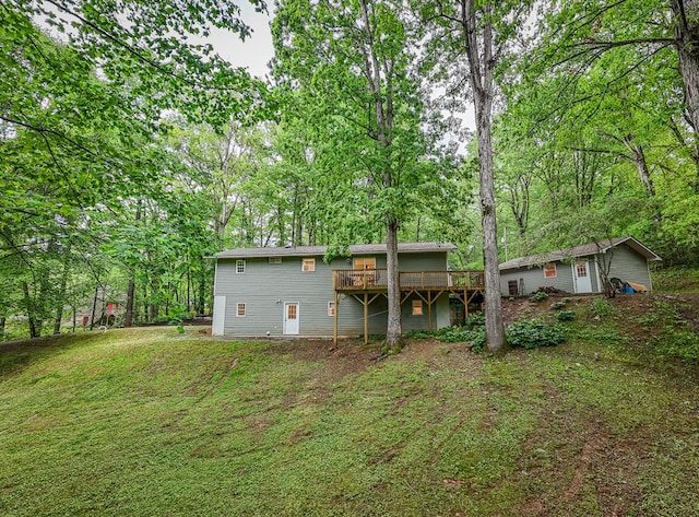 68 Phillips Crk, Andrews, NC 28901 - rear view of house featuring a wooden deck, a lawn, and an outbuilding