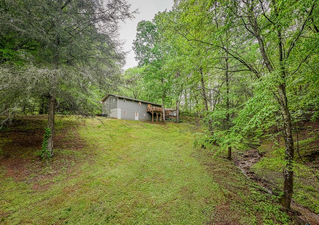 68 Phillips Crk, Andrews, NC 28901 - view of green lawn featuring a forest view and a deck
