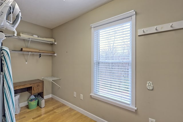 laundry room with light hardwood / wood-style flooring